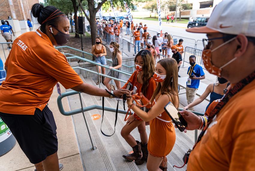 Scanning tickets at the student entrance to the Darrell K Royal-Texas Memorial Stadium for the first home football game of the season at the University of Texas at Austin on Sept. 12, 2020.