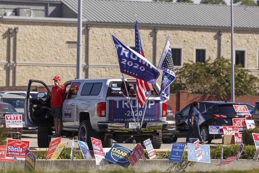 A Trump supporter with his truck at Harris County Trini Mendenhall Community Center in Houston,Tuesday, November 3, 2020 as voters head to the polls.