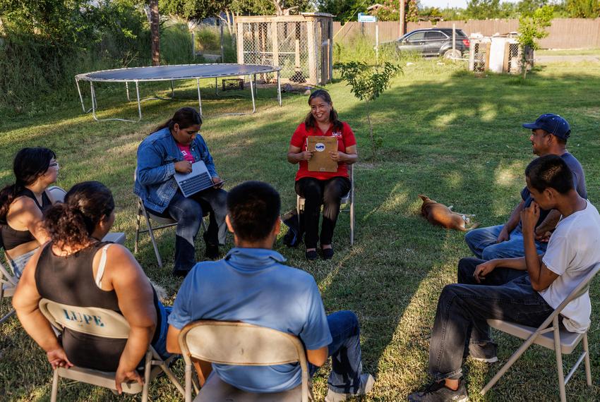 La Union del Pueblo Entero, LUPE, staff member Marcela Alejandre talks to a family during a focus group meeting in Donna on Aug. 14, 2024. LUPE staff has held focus group meetings to discuss issues important to members to determine the organizationís priorities for the next two years.