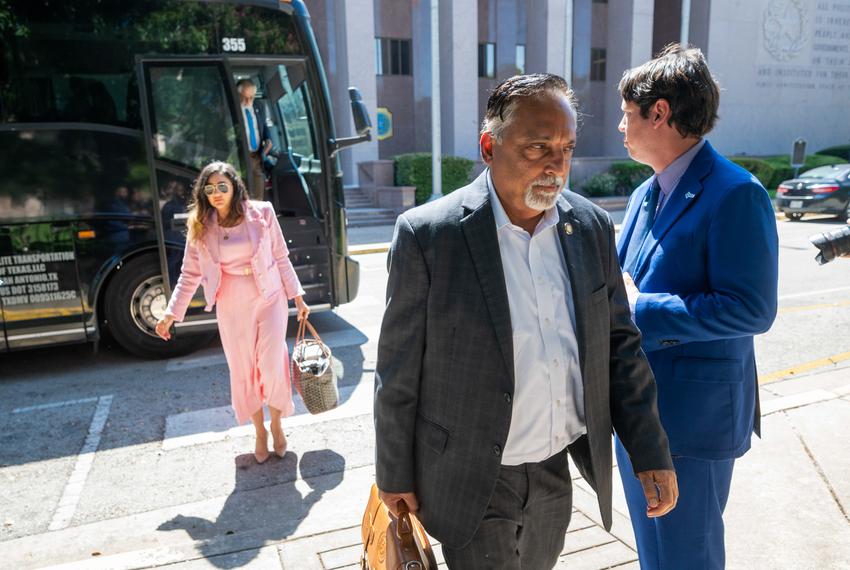 Texas Democrats including Dr. Suleman Lalani, D-Sugar Land,  r, get off a charter bus from the Austin airport outside the State Archives building on the east side of the Texas Capitol upon their return to Austin following a two-week quorum break.