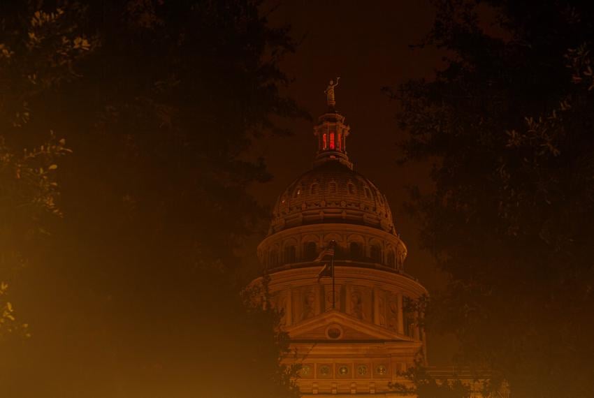 Streetlights and building lighting illuminate the Texas State Capitol through early morning fog on the ninth day of suspended Attorney General Ken Paxton’s impeachment trial in Austin, Texas, on Sept. 15, 2023.