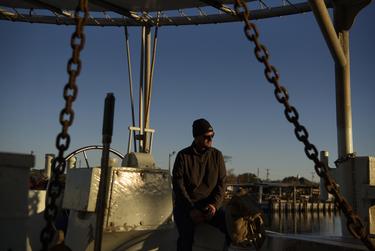 Johny Jurisich, an oyster fisherman whose family owns US Sea Products, a wholesale oyster company, poses for a portrait on an oyster boat after the Texas Department of State Health Services ordered a recall for oysters harvested in the area of southeastern Galveston Bay in Texas City, Texas, U.S., on Thursday, December 15, 2022.