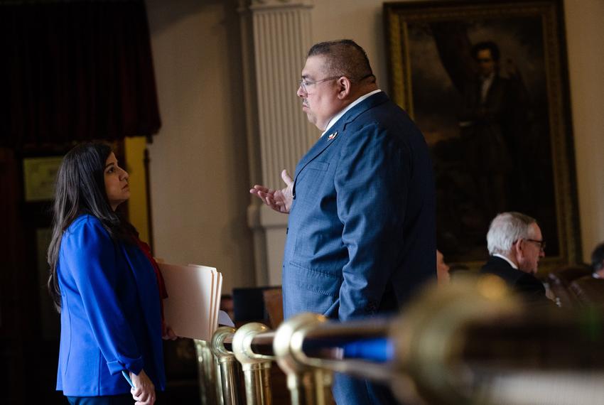 State Rep. Janie Lopez speaks with State Rep. Ryan Guillen, R-Rio Grande City, on the House floor during session at the state Capitol in Austin on May 22, 2023.