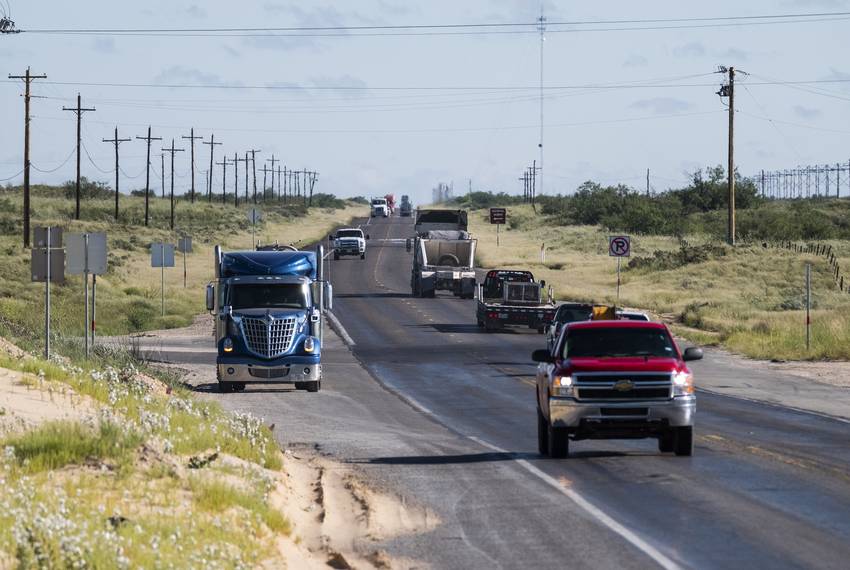 Early morning oilfield traffic on State Highway 115 near Kermit.