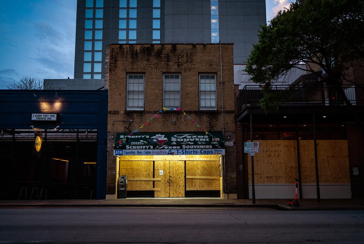 Shuttered businesses on  Sixth Street in Austin during the COVID-19 pandemic on March 19, 2020.