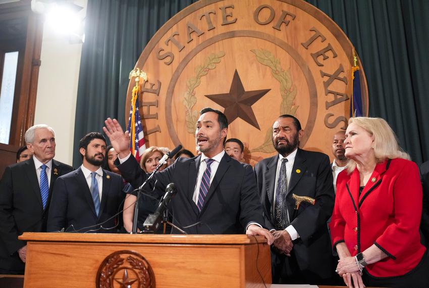 U.S. Reps. Lloyd Doggett and Greg Casar, both of Austin (left), listen as Joaquin Castro, D-San Antonio speaks during a press conference with Texas Democratic leaders  at the Texas Capitol on July 31, 2025. Doggett and Casar could face each other in a primary under the new congressional redistricting maps drawn by the Texas Legislature at Pres. Trump's prompting.