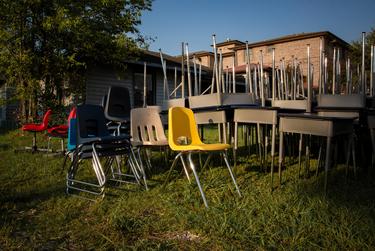 Surplus desks and chairs are provided to help students create effective learning spaces in their homes at the Drive-Thru Student School Supply Giveaway at Raul Yzaguirre Schools for Success in Houston on Aug. 22, 2020.