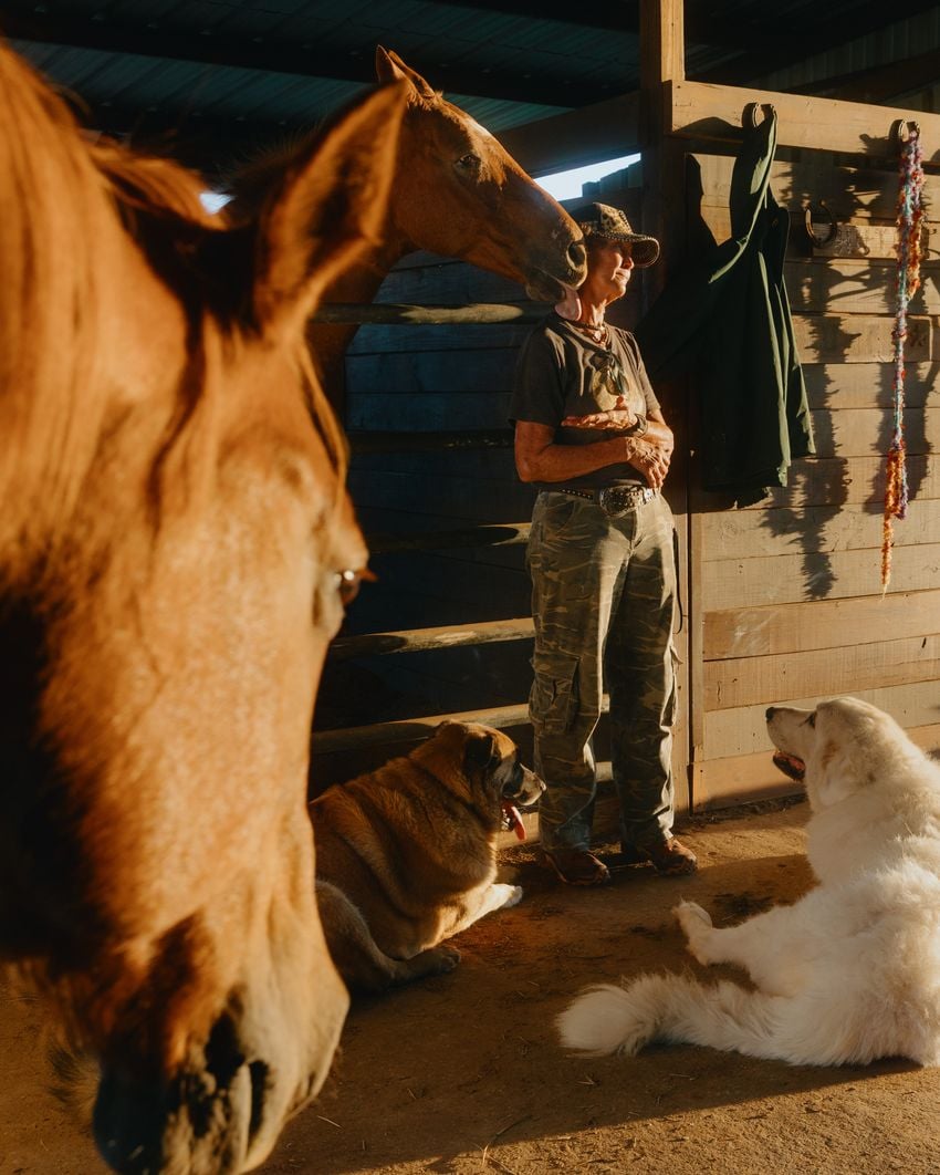 Cheryl Shadden offers treats to her horses on her land in Hood County on September 24, 2025. Shadden’s land, which she’s owned for 30 years, neighbors the Marathon cryptocurrency facility built in 2022.