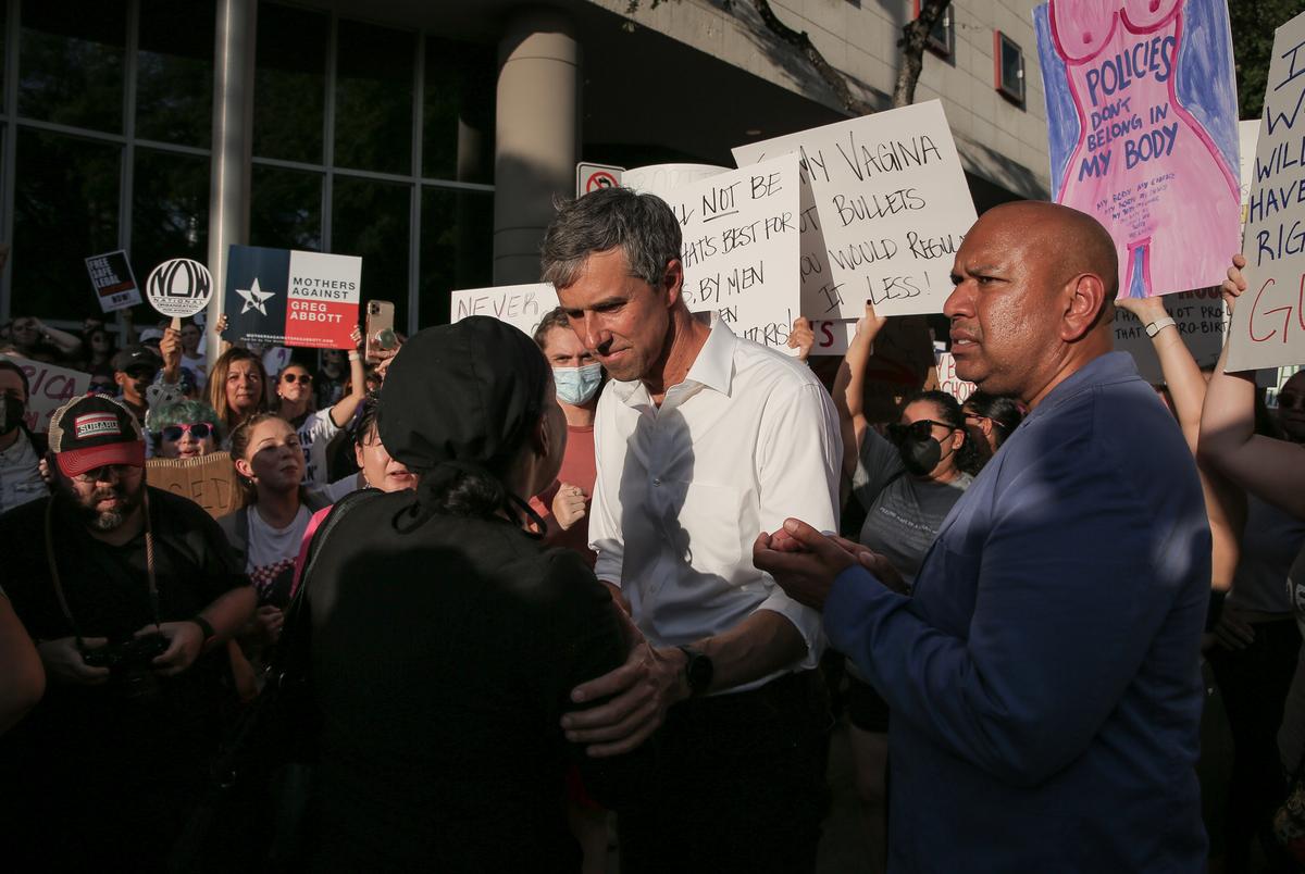 Beto O'Rourke listens to demonstrators in front of the Federal Courthouse hours after the Supreme Court ruled to overturn Roe v. Wade on Friday, June 24, 2022, in Houston, Texas.