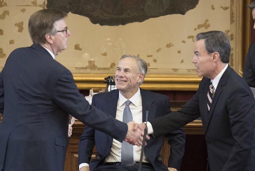 Gov. Greg Abbott looks on as Lt. Gov. Dan Patrick (left) and House Speaker Joe Straus shake hands at the Capitol on May 27, 2017. 