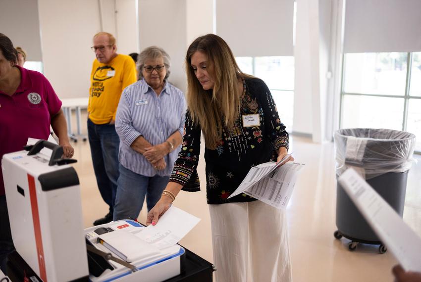 People test the polling equipment at the Hays County election office on Sept. 18, 2024.