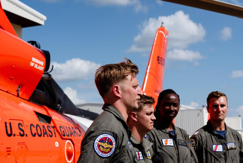 Members of the Coast Guard who aided in rescuing campers from Camp Mystic during the flood event at a press event with the US Coast Guard at the Kerr County Airport in Kerrville on Friday July 11, 2025.