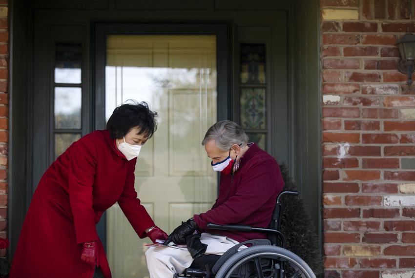 Gov. Greg Abbott joins state Rep. Angie Chen Button, R-Richardson, for a block walk on Oct. 24 in Richardson.