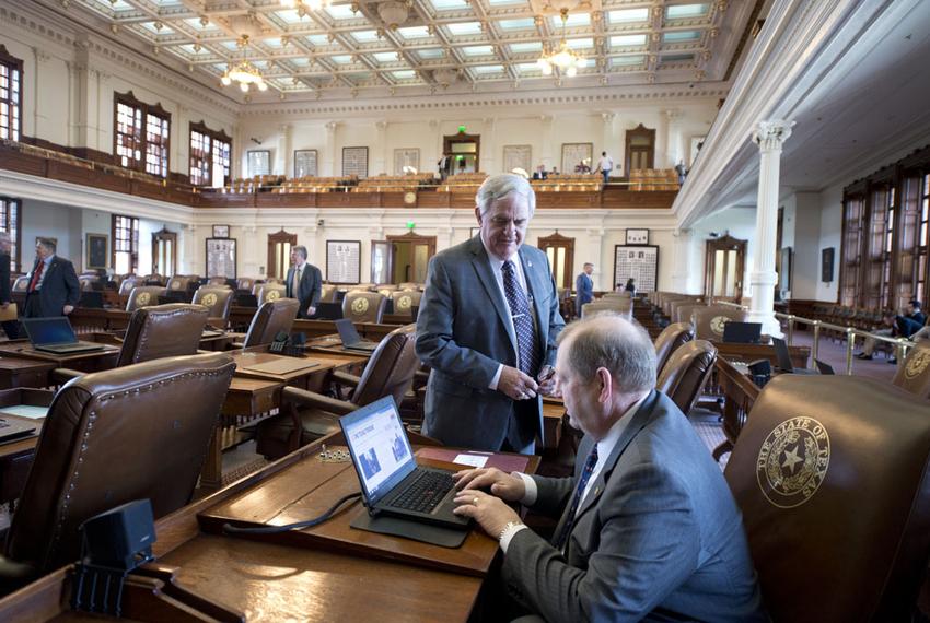 Texas House Appropriations Chairman John Otto, R-Dayton, looks at his computer while state Rep. Jimmie Don Aycock, R-Killeen, stands nearby on June 1, 2015.