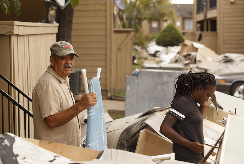 Jim Sauceda, left, with girlfriend Janel Williams, clean up after their second flooding at Collingwood Gardens apartment complex near Greens Bayou in the Greenspoint area of Houston on Sept. 6, 2017.