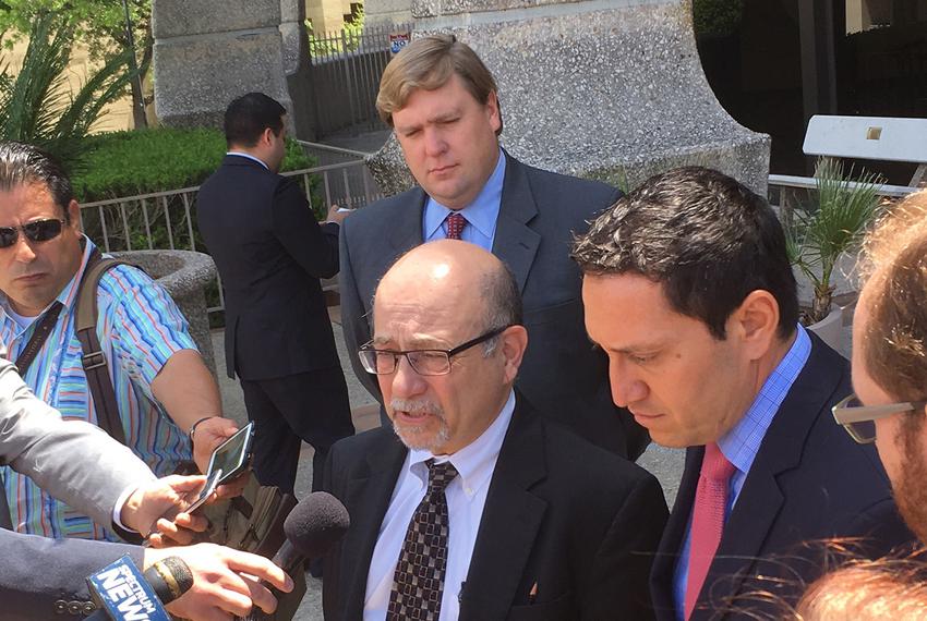 Jose Garza, an attorney for the Mexican American Legislative Caucus, and former Texas Rep. Trey Martinez Fischer speak to reporters on April 27, 2017, following a status conference on a years-long challenge to Texas' political maps. 