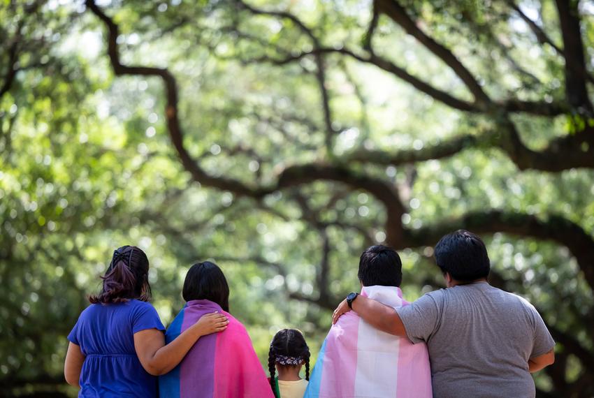 Laura, left, and her family pose for a photo at Discovery Green in downtown Houston on Sunday, June 25, 2023.