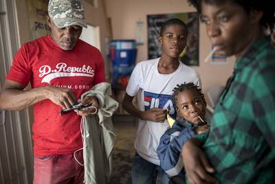 From left: Roberto Kabuya Mutombo of the Congo with his family Lucas, Acacia, and Sara at El Buen Pastor migrant shelter on May 13, 2019, in Ciudad Juárez. Mutombo and his family just arrived at the border city.