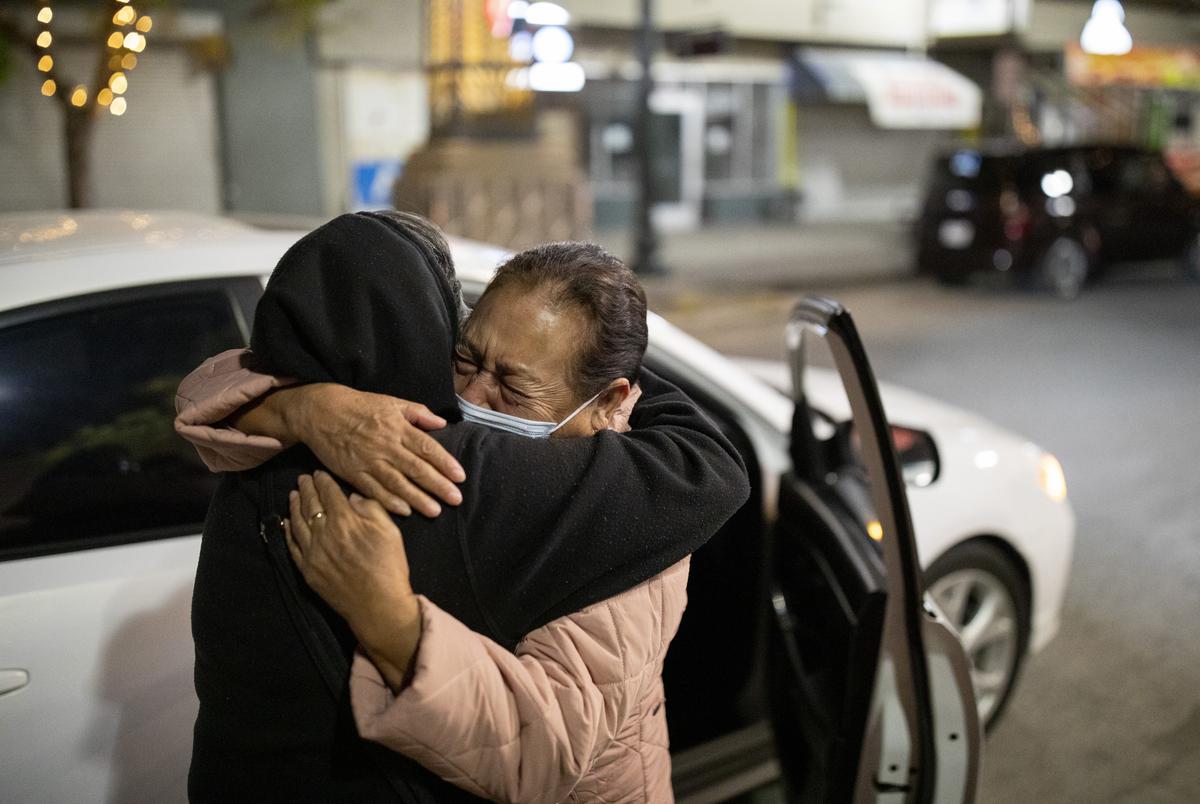 Susana Garcia, left, embraces her sister, Martha Garcia, near the Paso del Norte International Port of Entry after not seeing her for nearly 2 years, Monday, November 8, 2021, in El Paso, TX. Garcia is one of the first persons to cross into El Paso from Juarez after the reopening of the border to vaccinated nonessential travelers. The border had been closed for nearly 20 months due to the global pandemic.