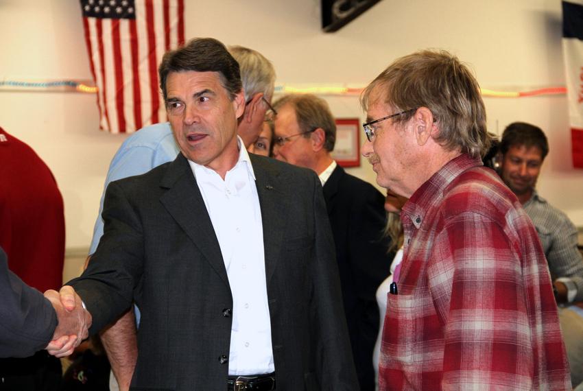 Texas Gov. Rick Perry greets an Iowa voter at a GOP event in Greene County.