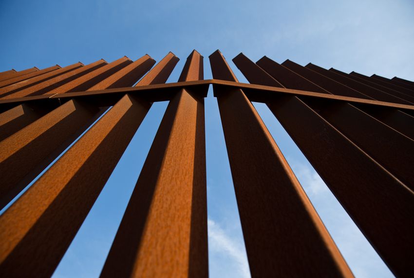A portion of the bollard-style border fence along the Rio Grande in South Texas.