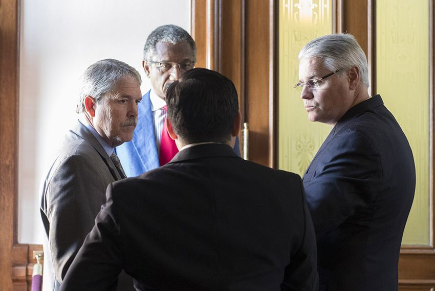State Sen. Larry Taylor, R-Friendswood (l.), chairman of the Senate Education Committee, and Rep. Dan Huberty, R-Houston (r.), chairman of the House Public Education committee, talk with Rep. Harold Dutton, D-Houston (facing), and Rep. Diego Bernal, D-San Antonio (back), on May 27, 2017.