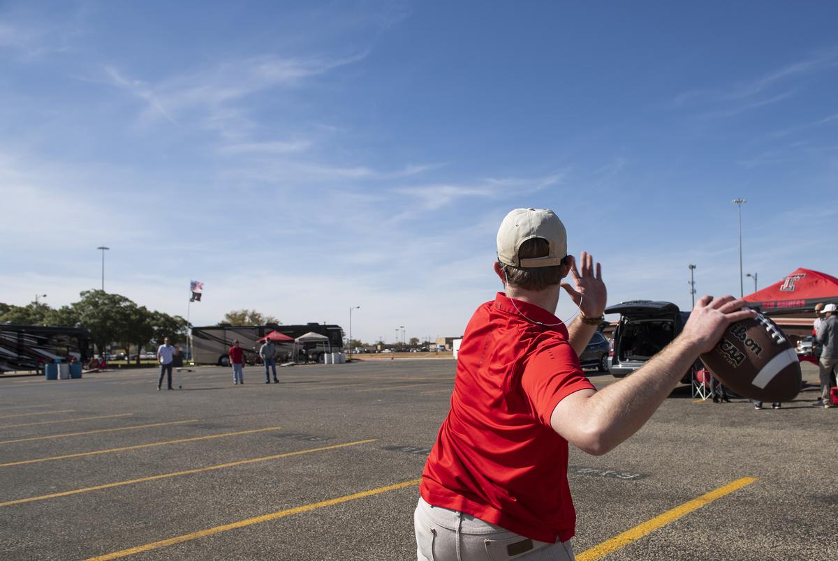 Charlie McBride throws a football before Texas Tech's home coming game against West Virginia at Texas Tech University on Saturday in Lubbock. Oct. 24, 2020. 