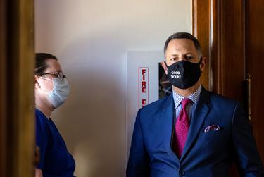 Rep. Rafael M. Anchia, D-Dallas, speaks with his colleague Rep. Erin Zwiener, D-Driftwood on the house floor on Thursday, May 6, 2021.