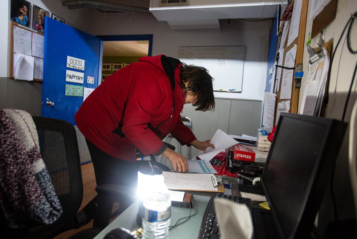 Food pantry manager Farrah Rivera map out routes to resident rooms at the Rebekah Baines Johnson Center in Austin on Feb. 17, 2021.