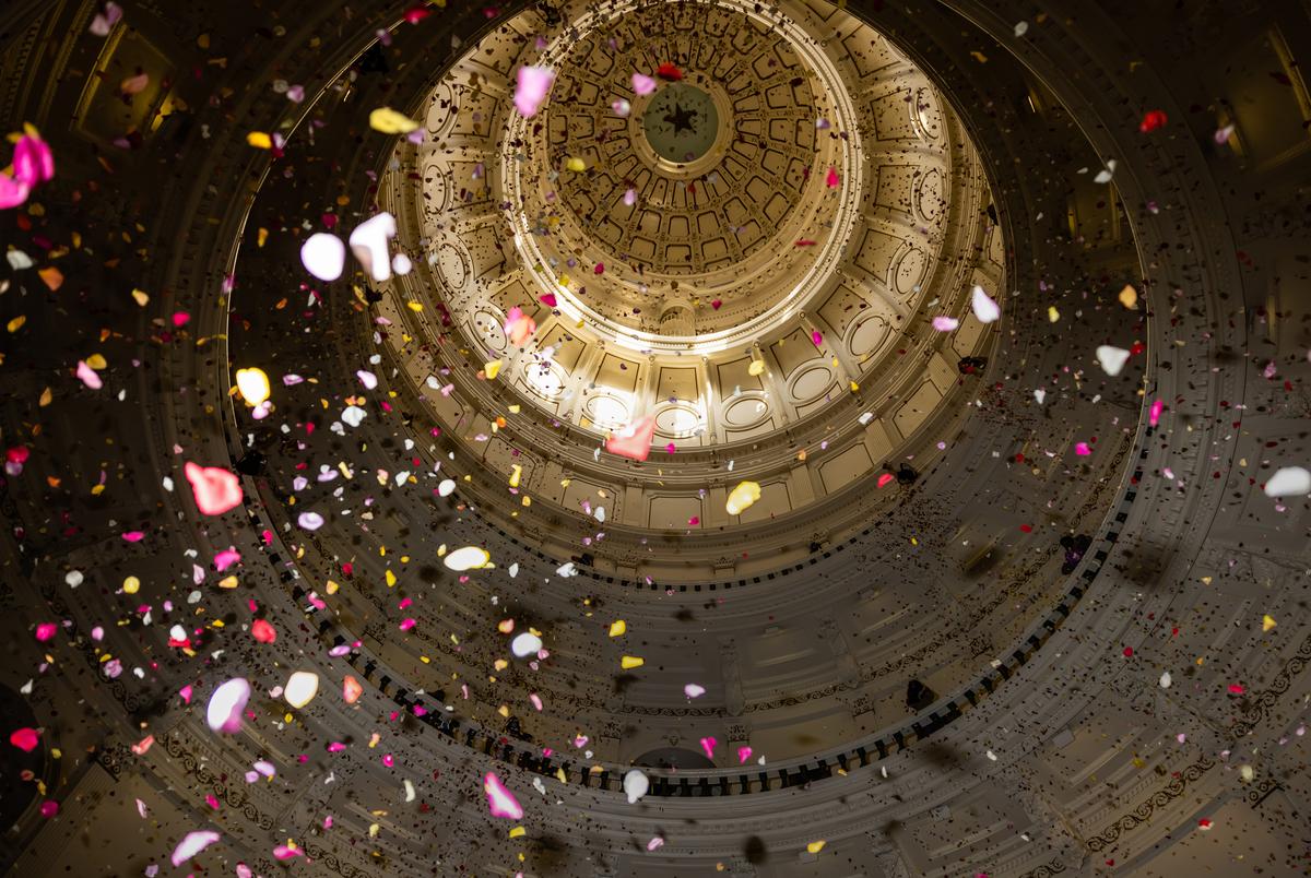 Youth activists deploy over 200,000 rose petals from the capitol rotunda to protest against what they describe as “Extremist Voter Suppression Legislation” currently making it’s way through the elections committee in the Texas House of Representatives on Thursday, April 8, 2021.