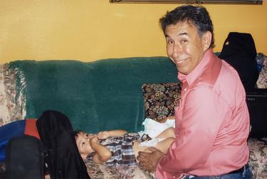 Alvarado with one of his grandchildren, Judah.