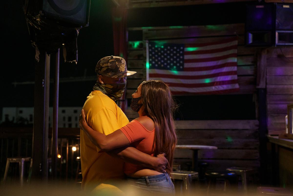 From left, Malachi Bryant and Jay Smith, dance together on their first date at Veranda Rooftop Bar and Patio in San Marcos. Gov. Greg Abbott recently allowed bars to reopen at 50% capacity. Oct. 17, 2020. 