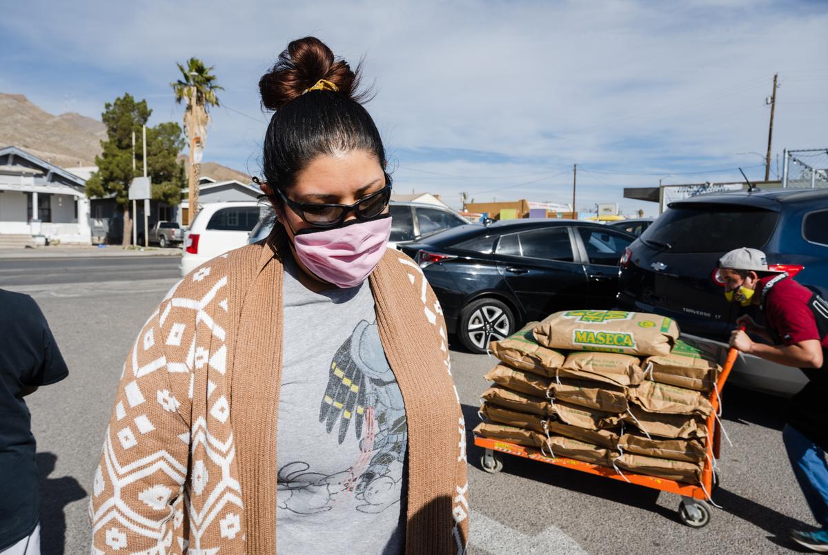 Monica Ponce, 35, in line at La Rotativa for nixtamal for their family’s Christmas menudo. El Paso on Dec. 23, 2021.