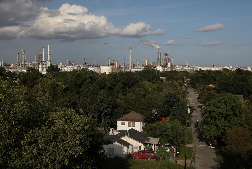 A house stands in the Manchester neighborhood while refineries are visible in the background in Houston on Sept. 8, 2018.