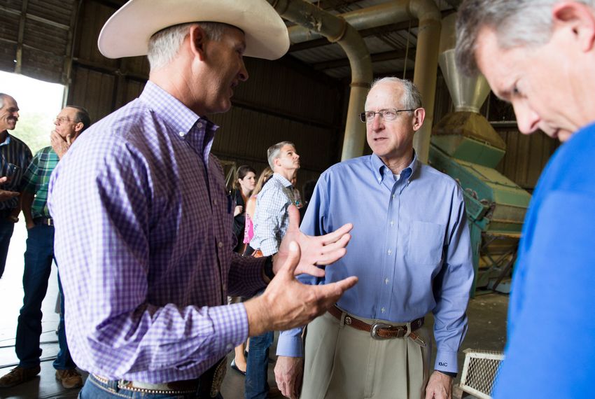 U.S. Rep. Mike Conaway, R-Midland, speaks with farmers last year in San Angelo.