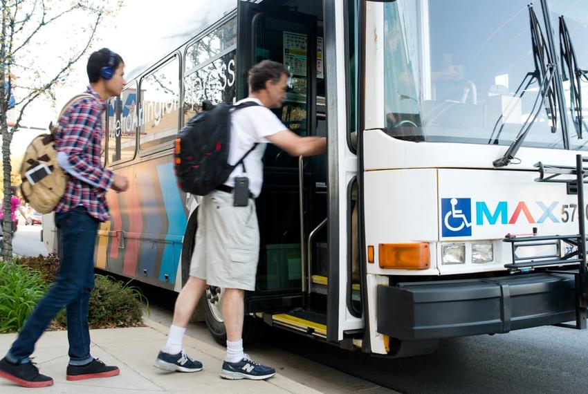 Passengers board the Metro ArlingtonXpress at the University of Texas at Arlington bus stop on March 31, 2014.