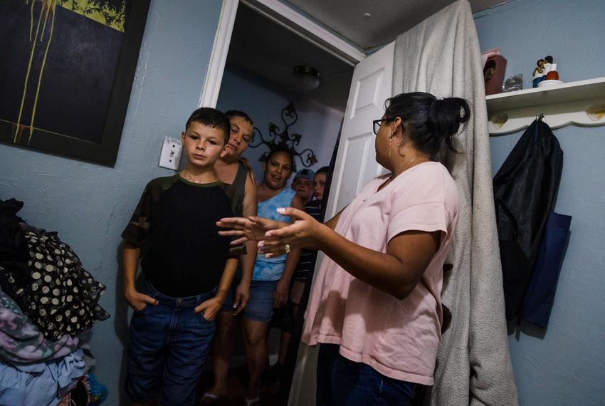 Paola Valdez and her husband, Evan, discuss the deal they just struck with a family interested in buying their home at the Congress Mobile Home Park in Austin on Aug. 4, 2022. If all goes well, they would recieve a cash payment for the property as soon as the coming Sunday.