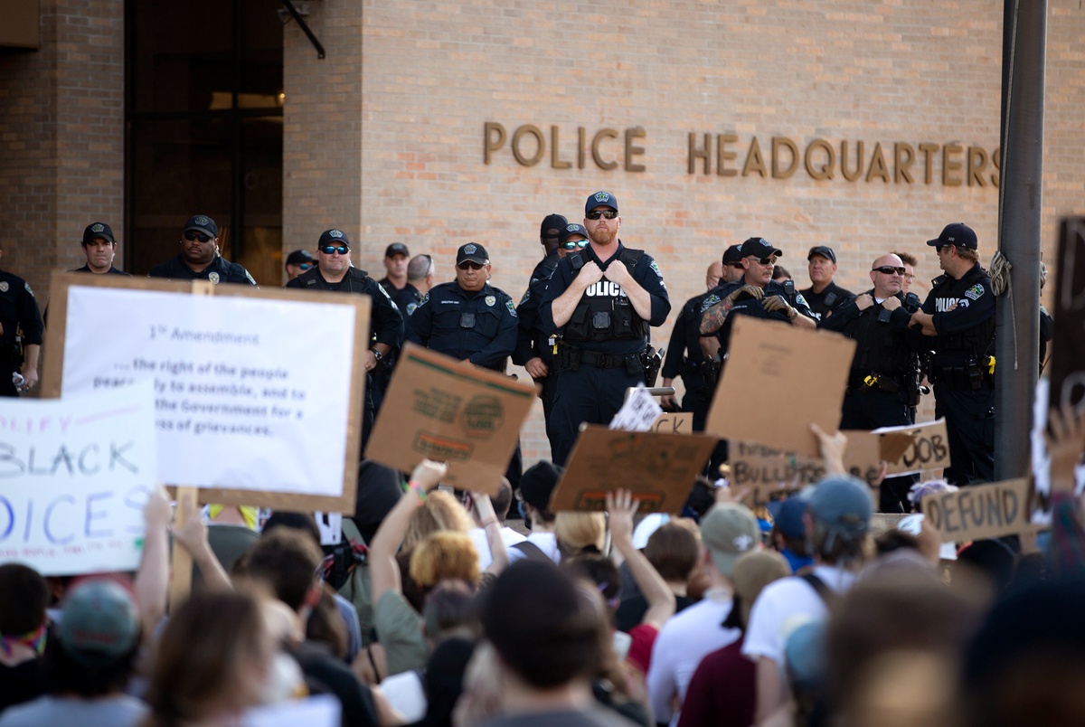 Austin City Council votes to cut police department budget by one-third, reinvest money in social services