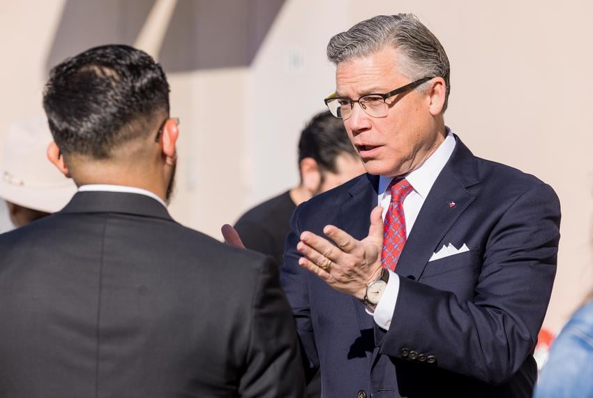 Joe Jaworski, a Democratic candidate for attorney general, speaks with Frank Ramirez at a campaign event in San Antonio on Oct. 31, 2021.