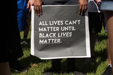 A demonstrator holds his sign at a rally for George Floyd in Vidor on June 06, 2020. Organizers of the rally in Vidor, historically known as a 