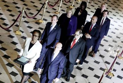 U.S. House of Representatives Clerk Cheryl Johnson and House Sergeant at Arms Paul Irving carry two articles of impeachment against U.S. President Donald Trump during a procession with the seven U.S. House impeachment managers through Statuary Hall in the U.S. Capitol in Washington, D.C. on January 15, 2020. Garcia is at the rear.