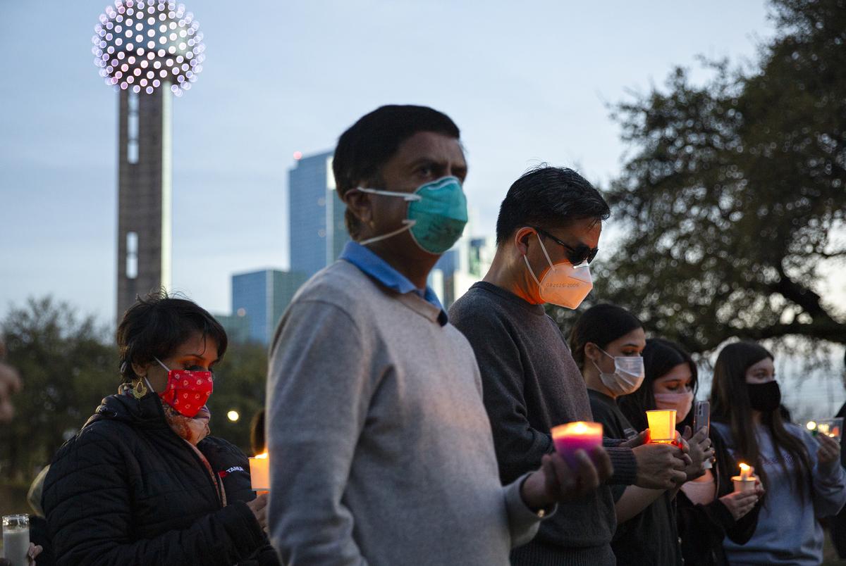 People gathered at the Grassy Knoll in Dallas to stand in solidarity with the Asian community and to honor the victims of the recent shootings in Atlanta.