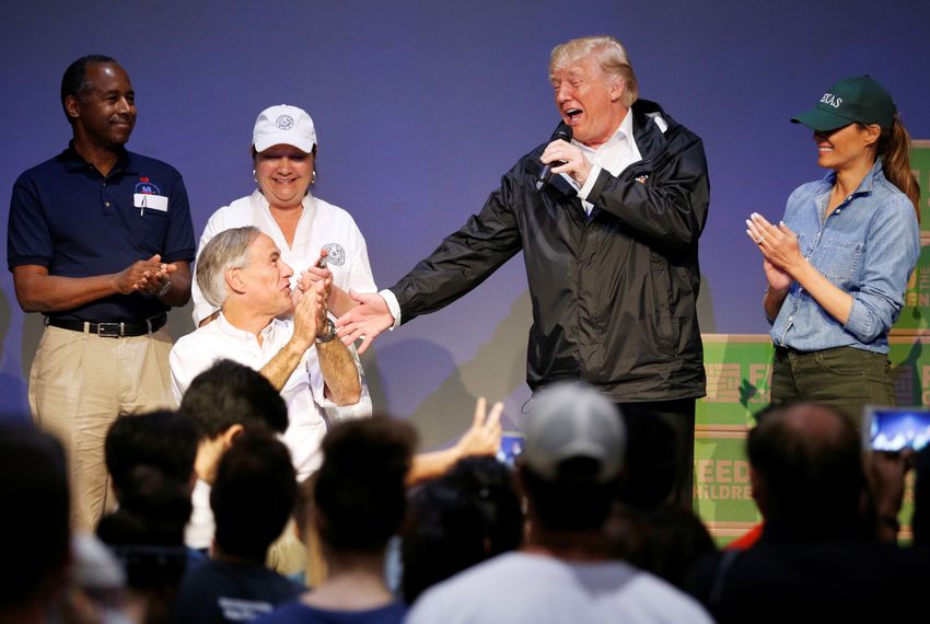 Gov. Greg Abbott and President Donald Trump visited with volunteers and survivors of Hurricane Harvey in Houston in 2017.