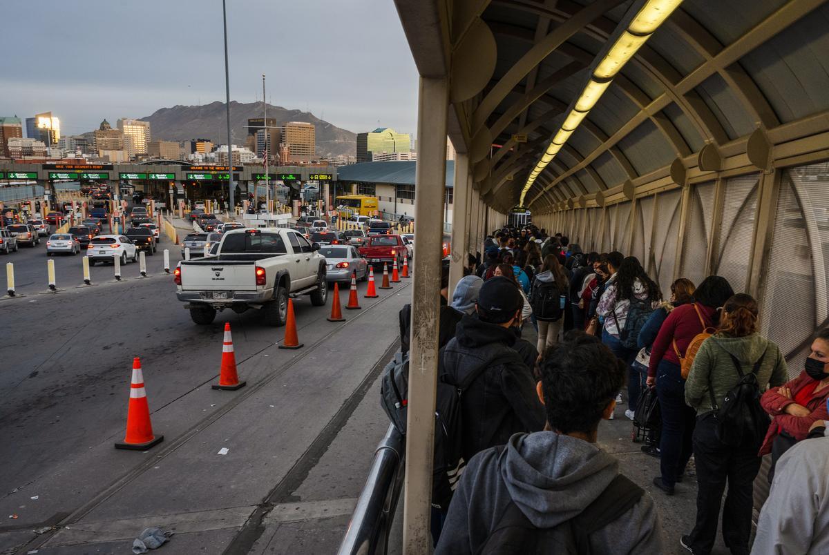 People wait in line on the Paso del Norte International Bridge to enter El Paso, Texas from Ciudad Juárez, Mexico after the United States opened the border with Mexico on November 8, 2021.
