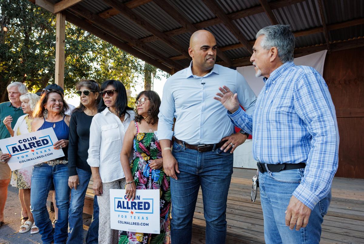 Former U.S. Rep. Colin Allred speaks to a supporter following a town hall meeting in Brownsville on Oct. 3, 2025.