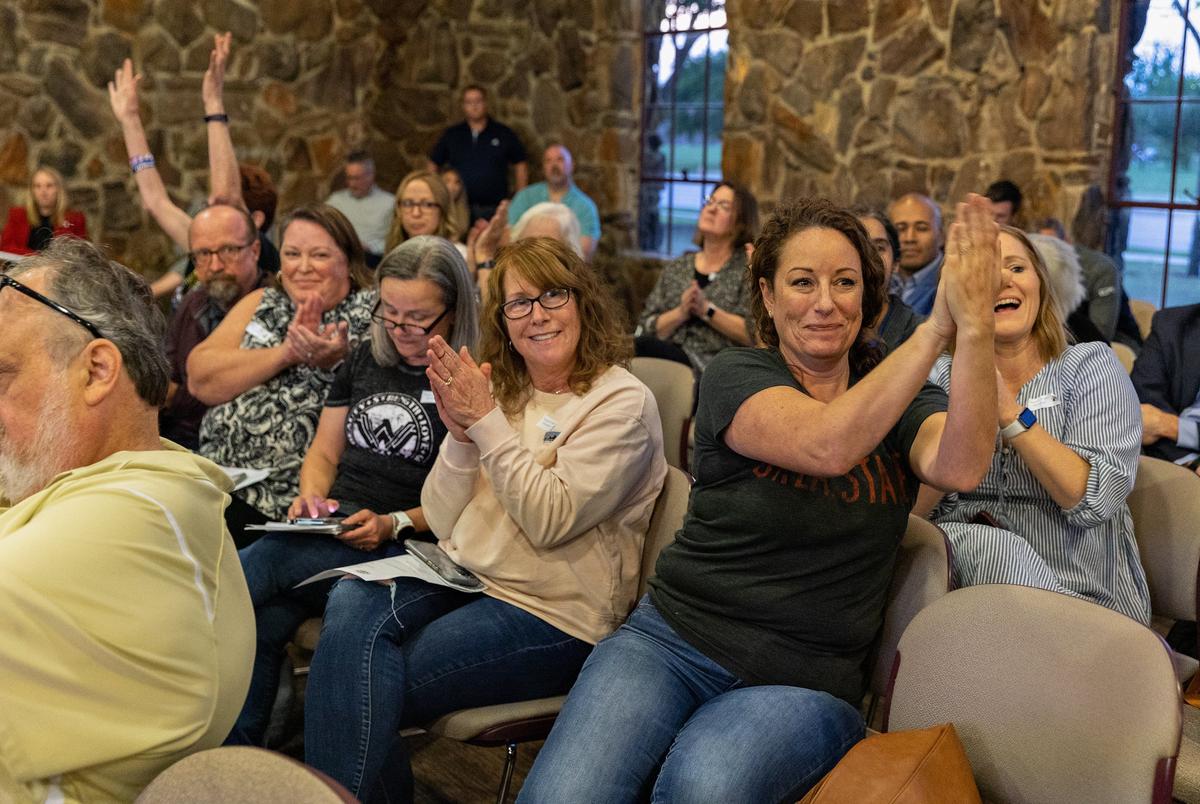 Visitors applaud after a public comment concludes at a Keller ISD school board meeting in Keller on April 25, 2022.