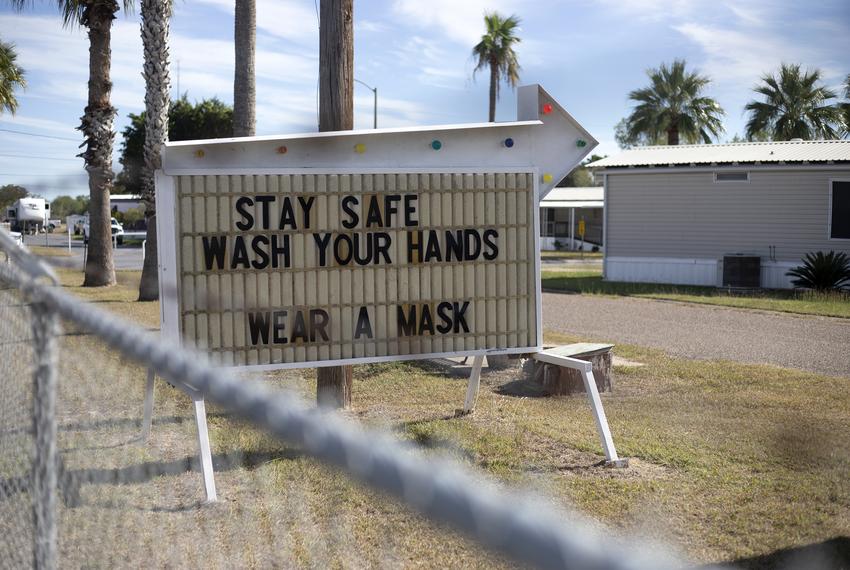 A sign urges resident to stay safe during the COVID-19 pandemic in Hidalgo County. Dec. 7, 2020.