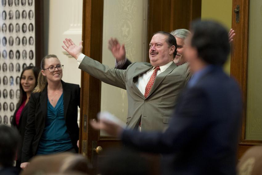 11:14 p.m.— State Rep. Rene Oliveira, D-Brownsville, enters the chamber during a vote verification. 