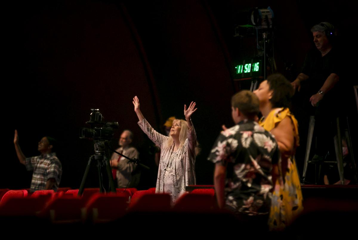 Worshippers sing during an Easter service at the Glorious Way Church in Houston. Attendees maintained social distance during the two services and used hand sanitizer upon entry and exit.