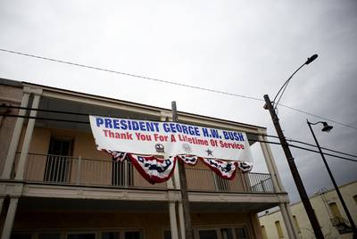A banner thanking former President George H.W. Bush hangs near downtown Navasota. The funeral train carrying the president's remains will pass through town on its way to College Station.